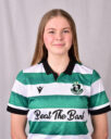 Female Shamrock Rovers player in green and white jersey smiling.