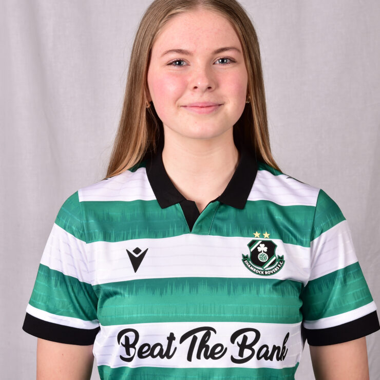 Female Shamrock Rovers player in green and white jersey smiling.