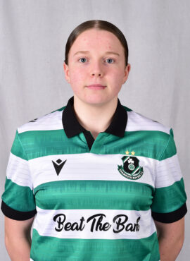 Female Shamrock Rovers football player in team jersey.