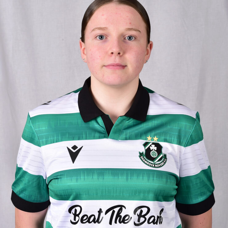 Female Shamrock Rovers football player in team jersey.