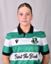Female Shamrock Rovers player in green and white jersey, close-up portrait.