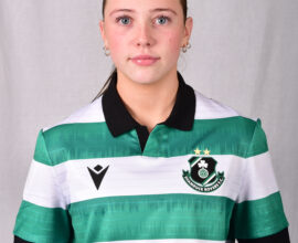 Female Shamrock Rovers player in green and white jersey, close-up portrait.