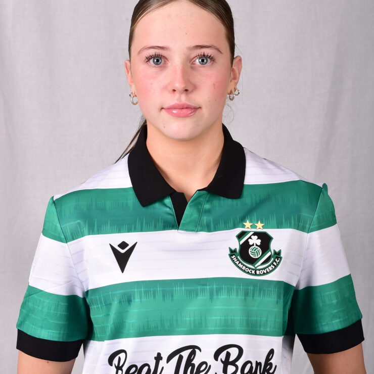Female Shamrock Rovers player in green and white jersey, close-up portrait.