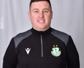 Portrait of a Shamrock Rovers football player in team kit.