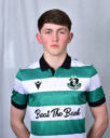 Young Shamrock Rovers player in team jersey, standing confidently.