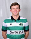 Young Shamrock Rovers footballer in green and white kit smiling at camera.