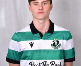 Young Shamrock Rovers football player in green and white jersey.