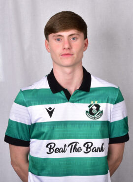 Young Shamrock Rovers football player in green and white jersey.