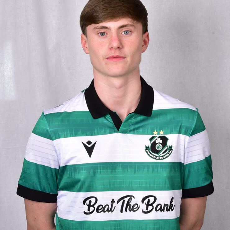 Young Shamrock Rovers football player in green and white jersey.