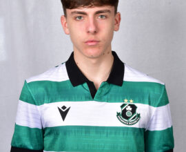 Young Shamrock Rovers player in green and white jersey, facing front.