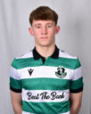 Young Shamrock Rovers footballer in team kit, facing camera, neutral background.