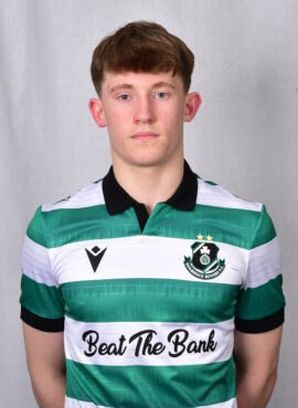 Young Shamrock Rovers footballer in team kit, facing camera, neutral background.