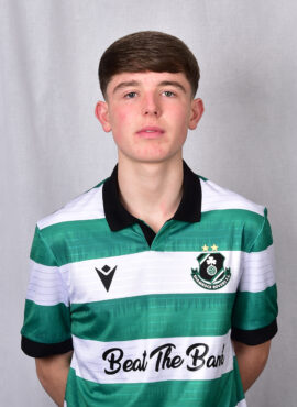 Player in Shamrock Rovers football kit, showcasing team colours and logo.