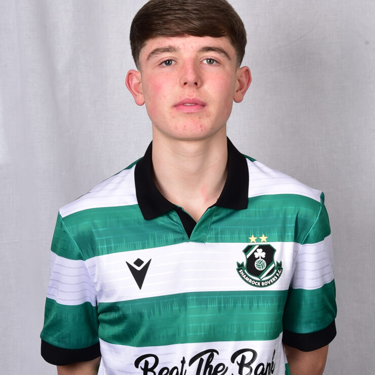 Player in Shamrock Rovers football kit, showcasing team colours and logo.