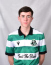 Young Shamrock Rovers player in green and white striped jersey.