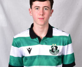 Young Shamrock Rovers player in green and white striped jersey.