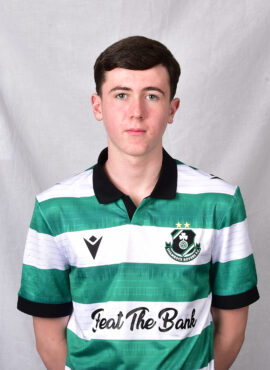 Young Shamrock Rovers player in green and white striped jersey.