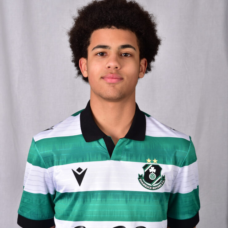 Young Shamrock Rovers player in green and white jersey, facing camera.