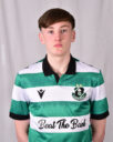 Shamrock Rovers football player in team jersey with club crest and sponsor logo.