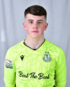 Shamrock Rovers goalkeeper in bright green jersey with team crest and sponsor logo.
