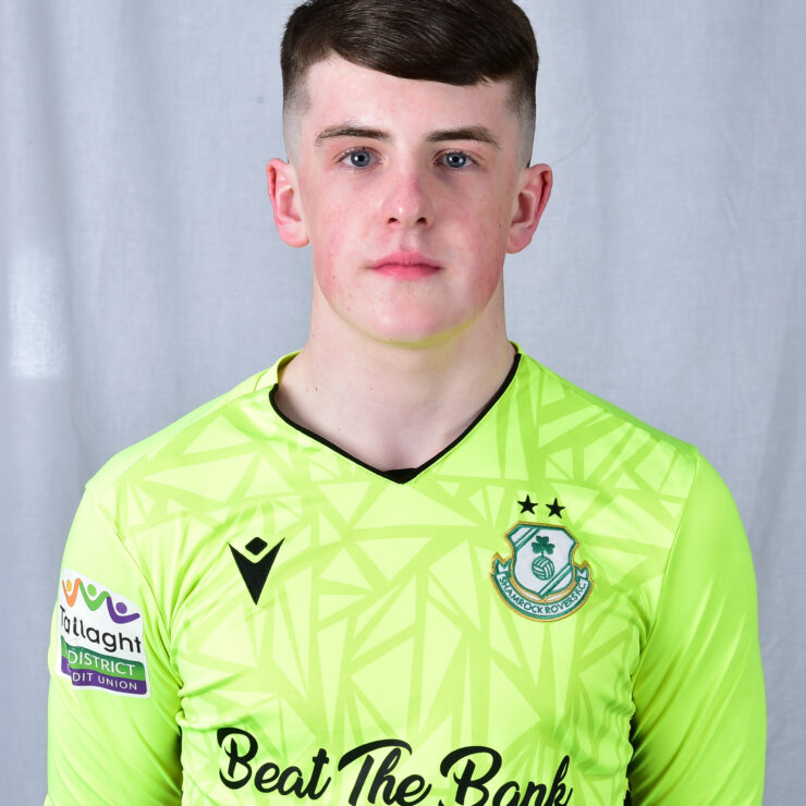 Shamrock Rovers goalkeeper in bright green jersey with team crest and sponsor logo.