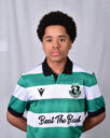 Young Shamrock Rovers football player in green and white jersey.
