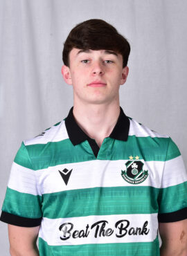 Young Shamrock Rovers football player in green and white kit.