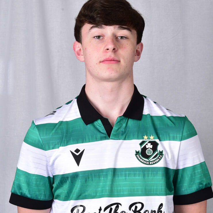 Young Shamrock Rovers football player in green and white kit.