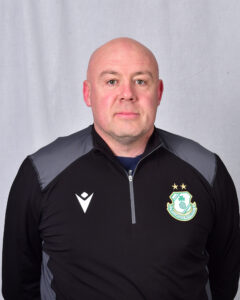 Shamrock Rovers coach in team jacket with club crest and stars.