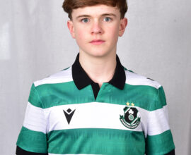 Young Shamrock Rovers player in green and white striped jersey.