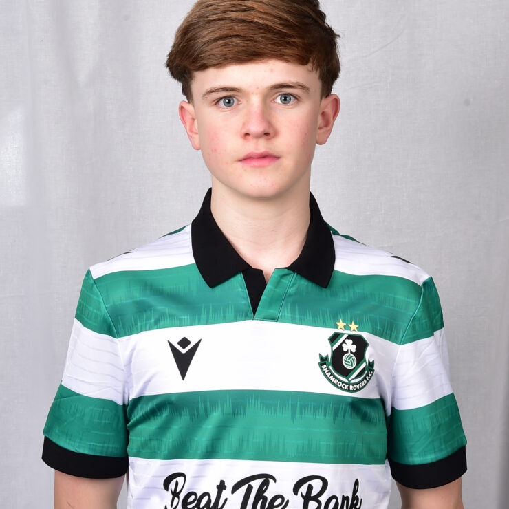 Young Shamrock Rovers player in green and white striped jersey.