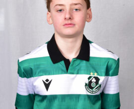 Young Shamrock Rovers player in team jersey.