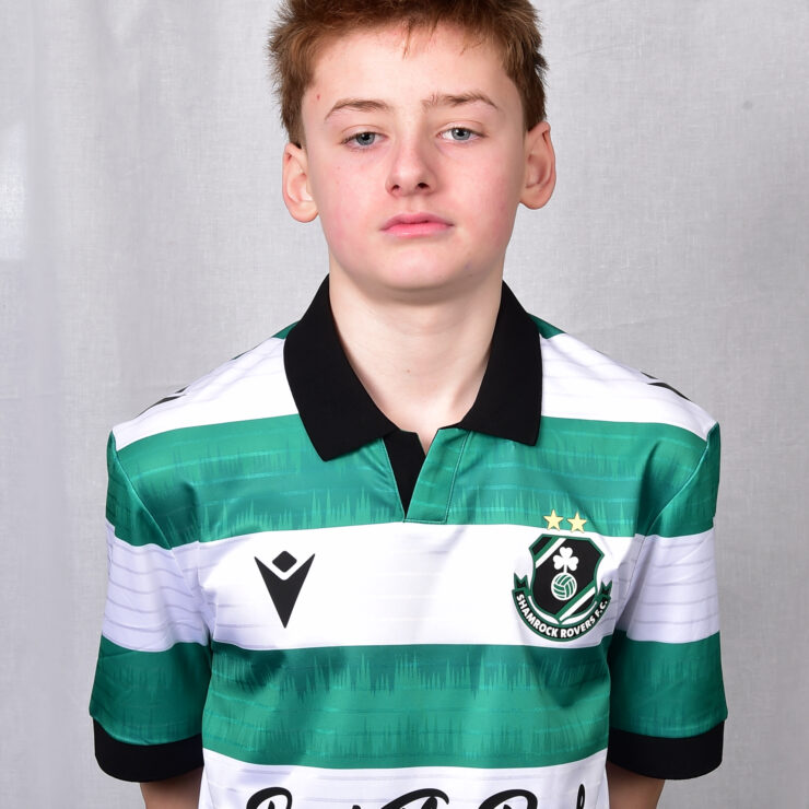 Young Shamrock Rovers player in team jersey.