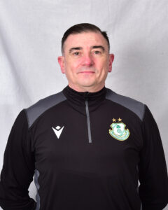 Portrait of Shamrock Rovers coach in team training gear.