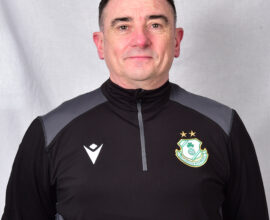 Portrait of Shamrock Rovers coach in team training gear.