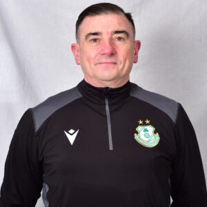 Portrait of Shamrock Rovers coach in team training gear.