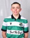 Shamrock Rovers football player in green and white striped jersey.