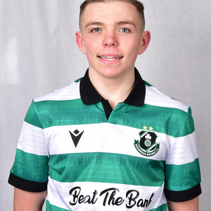 Shamrock Rovers football player in green and white striped jersey.