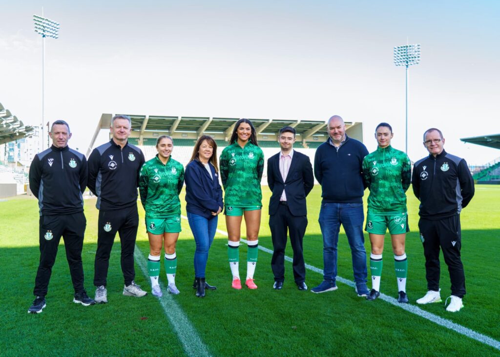 Shamrock Rovers players and staff with Tallaght & Firhouse Credit Union representatives on the pitch.