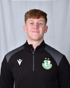 Darragh Connolly wearing Shamrock Rovers football kit, smiling.