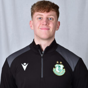 Darragh Connolly wearing Shamrock Rovers football kit, smiling.