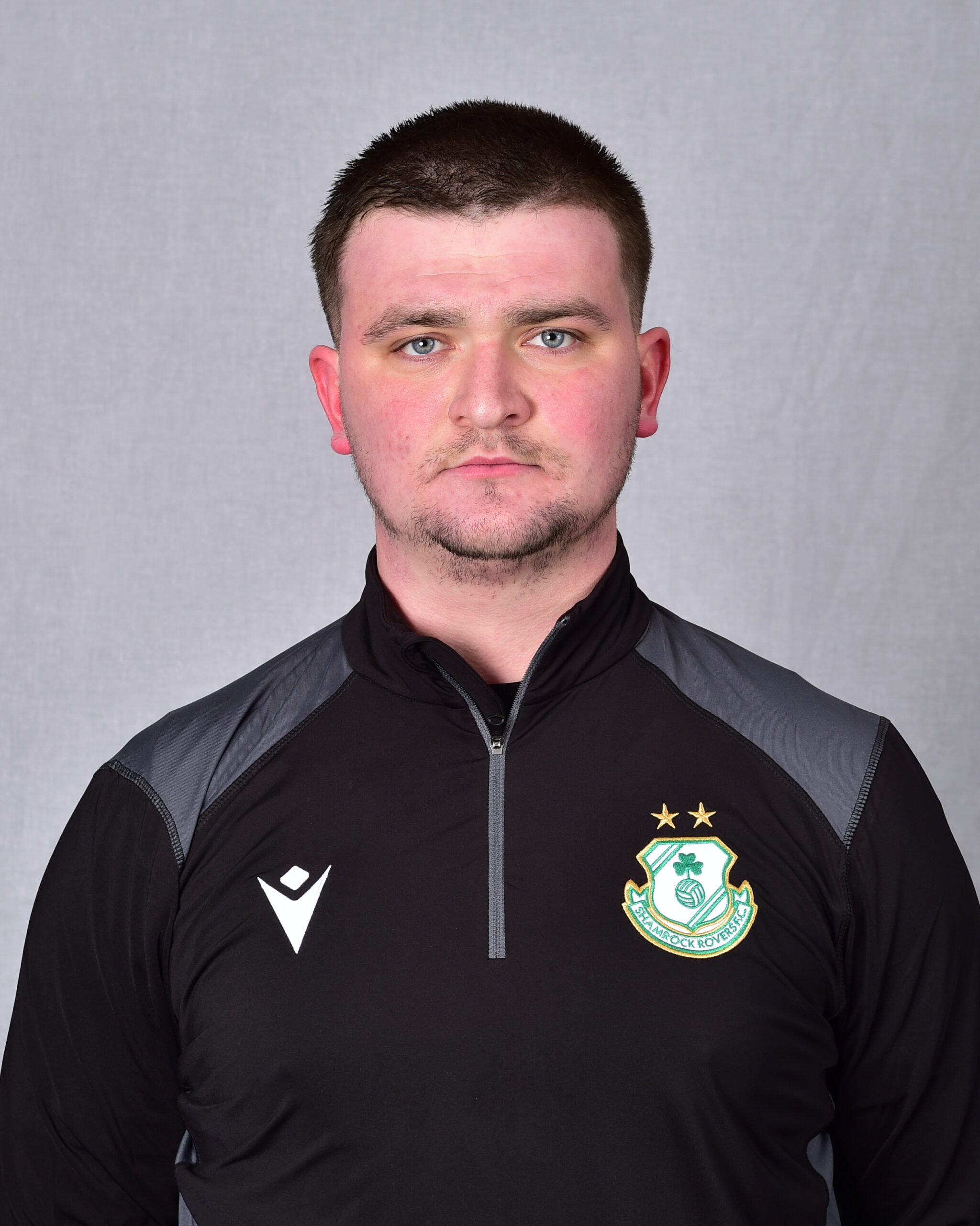 Close-up of Shamrock Rovers football player in team kit.