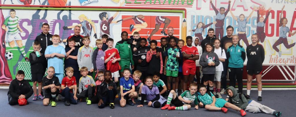Group of young football players and coaches at Shamrock Rovers training session.