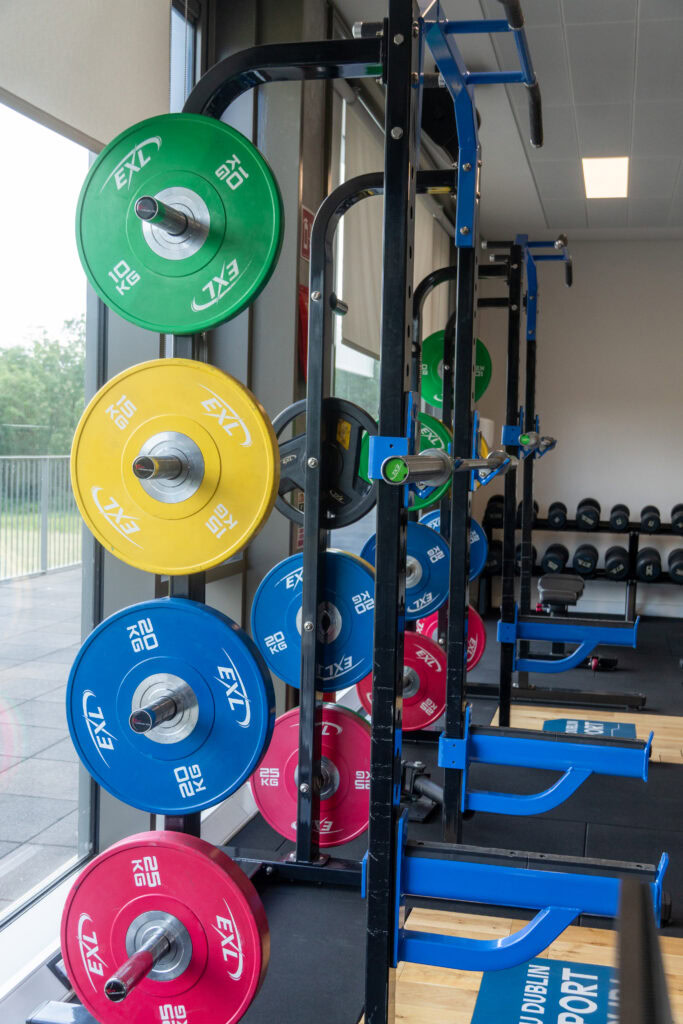 Colourful weight plates on a gym rack at SRFC Women’s Facility, TU Dublin Tallaght.