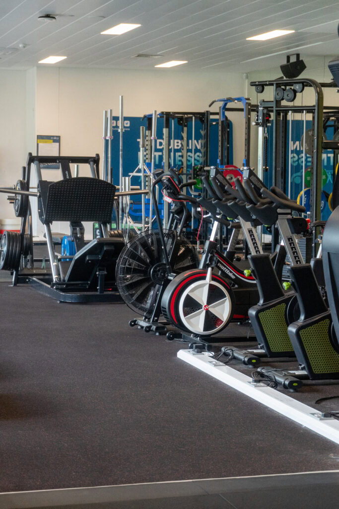 Indoor gym with cardio and strength training equipment at SRFC Women’s Facility.