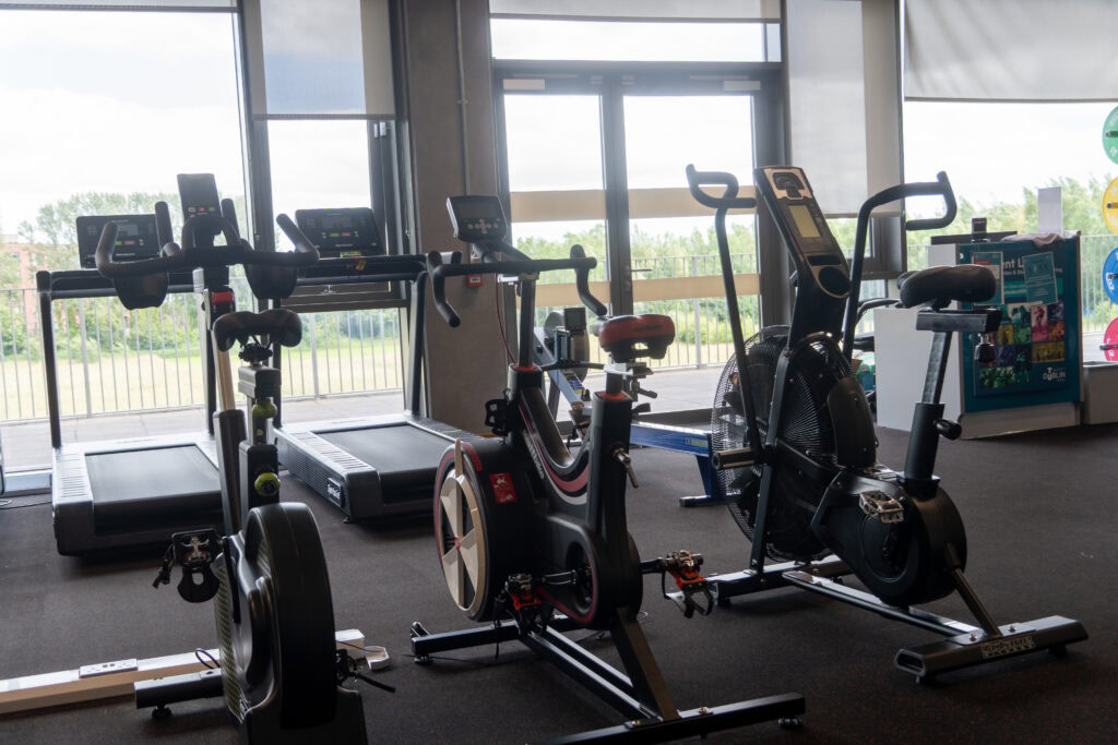 Indoor gym with exercise bikes and treadmills at TU Dublin Tallaght Campus.