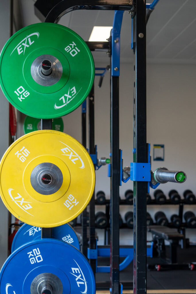 Colourful weight plates on a gym rack at SRFC Women’s Facility in TU Dublin Tallaght.